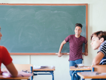 student-posing-front-class.jpg